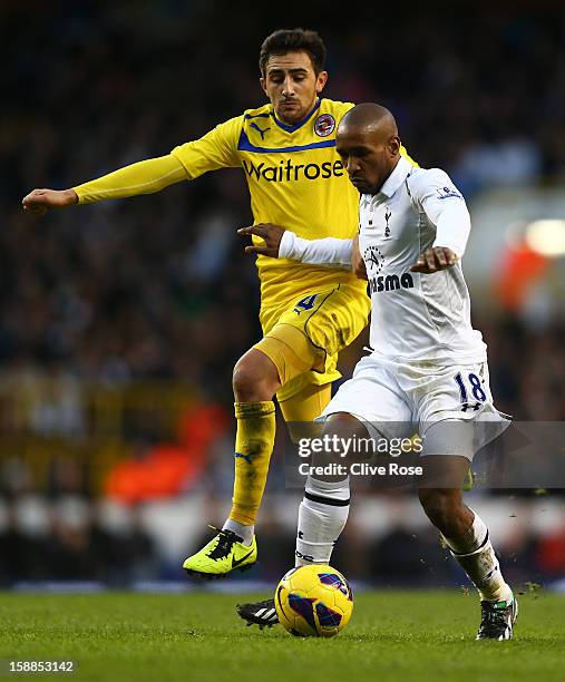 Jem Karacan of Reading and Jermain Defoe of Tottenham Hotspur battle for the ball during the Barclays Premier League match between Tottenham Hotspur...