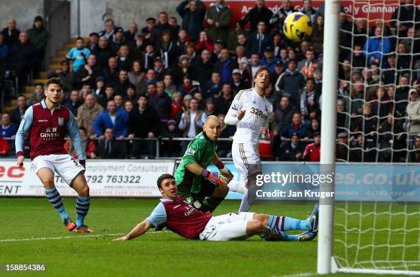 Michu of Swansea City looks on as his shot at goal hits the upright after beating Brad Guzan, Goalkeeper of Aston Villa during the Barclays Premier...