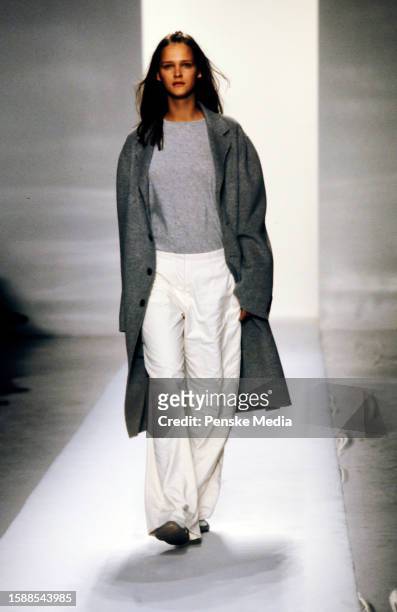 Model Carmen Kass walks in the DKNY Fall 1998 Ready to Wear Runway Show on March 29 in New York City.