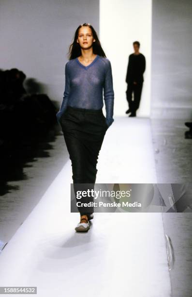 Model Carmen Kass walks in the DKNY Fall 1998 Ready to Wear Runway Show on March 29 in New York City.