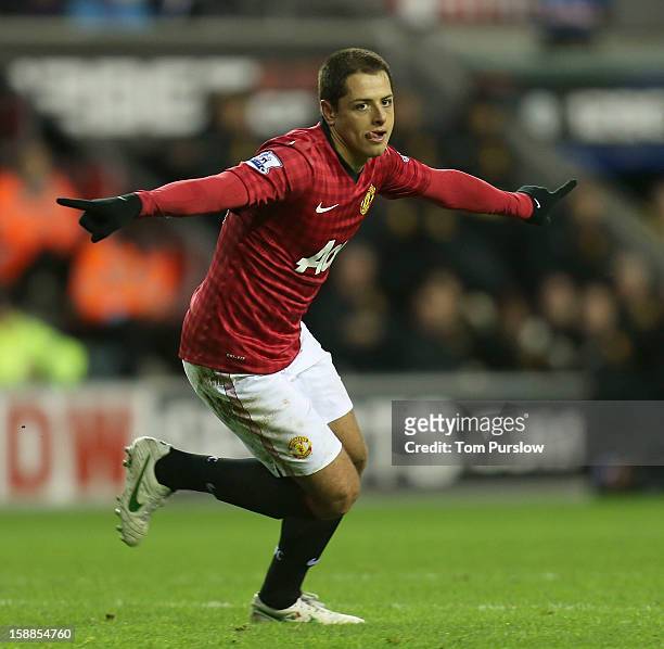 Javier "Chicharito" Hernandez of Manchester United celebrates scoring their third goal during the Barclays Premier League match between Wigan...