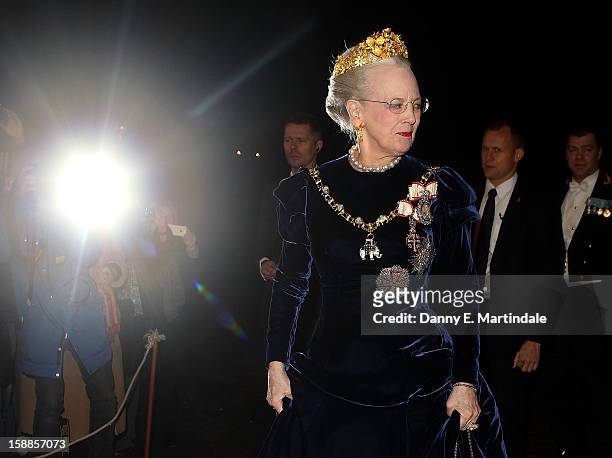 Queen Margrethe II of Denmark arrives at a New Year's Banquet hosted by Queen Margrethe of Denmark at Christian VII's Palace on January 1, 2013 in...