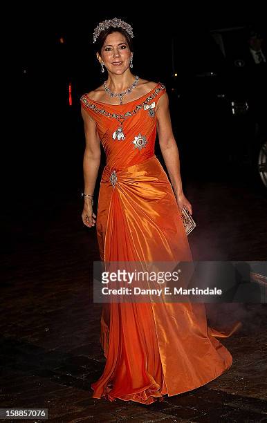 Princess Mary of Denmark arrives at a New Year's Banquet hosted by Queen Margrethe of Denmark at Christian VII's Palace on January 1, 2013 in...