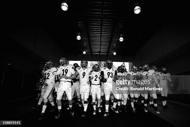 The Purdue Boilermakers walk to the field before play against the Oklahoma State Cowboys during the Heart of Dallas Bowl at Cotton Bowl on January 1,...