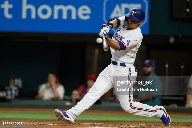 Corey Seager of the Texas Rangers hits a two run home run against the Chicago White Sox in the first inning at Globe Life Field on August 02, 2023 in...