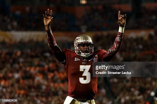Manuel of the Florida State Seminoles celebrates after he threw a 6-yard touchdown pass to Rashad Greene in the second quarter against the Northern...
