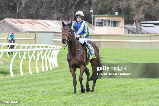 Jordan Childs returns to the mounting yard on Roadie after winning the bet365 Odds Drift Protector Maiden Plate at Bendigo Racecourse on August 10,...