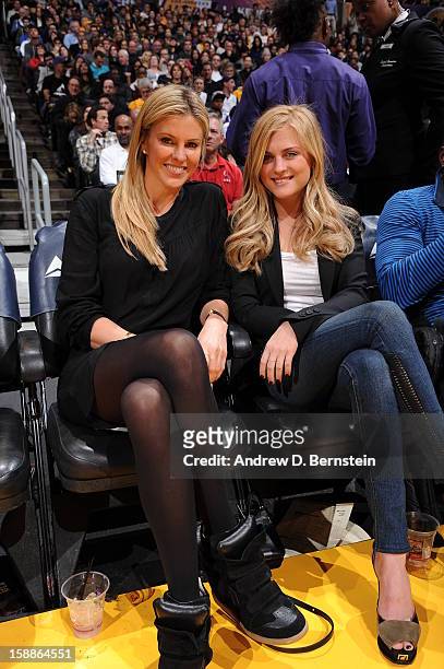 Actress Kelly Noonan and guest pose for a photograph at halftime of a game between the Philadelphia 76ers and the Los Angeles Lakers at Staples...