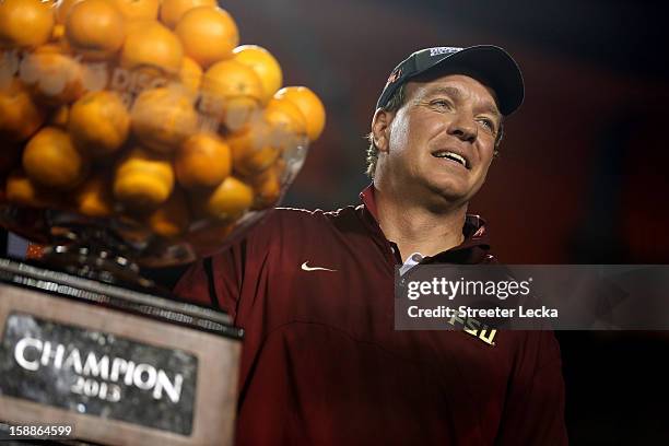 Head coach Jimbo Fisher of the Florida State Seminoles celebrates after they won 31-10 against the Northern Illinois Huskies during the Discover...