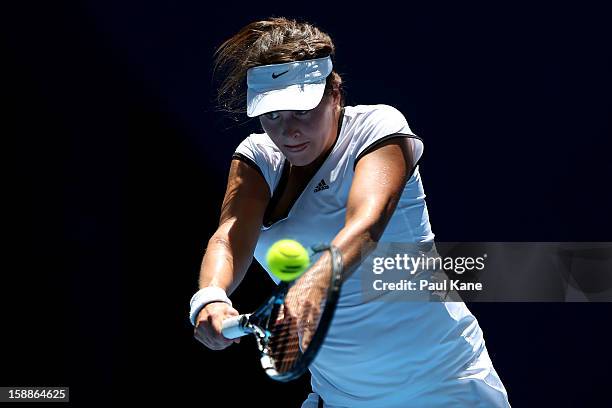 Tatjana Malek of Germany plays a backhand to Francesca Schiavone of Italy in her singles match during day five of the Hopman Cup at Perth Arena on...