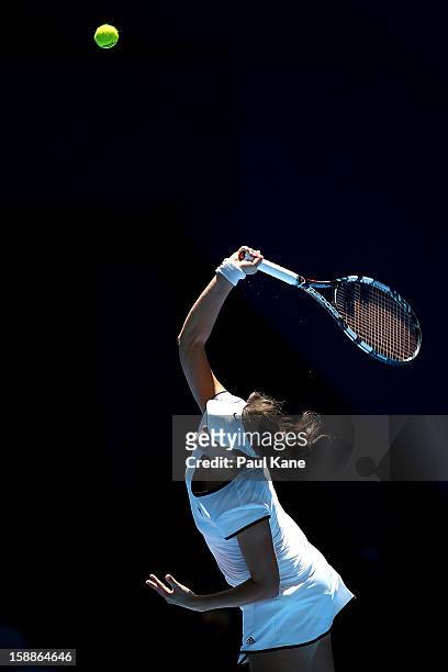 Tatjana Malek of Germany serves to Francesca Schiavone of Italy in her singles match during day five of the Hopman Cup at Perth Arena on January 2,...