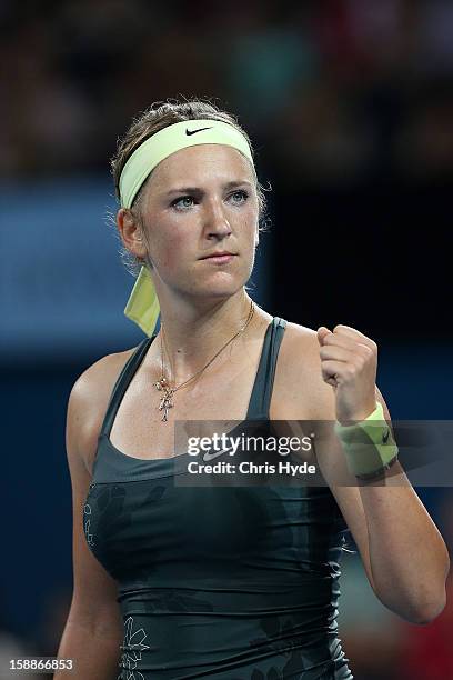 Victoria Azarenka of Belarus celebrates winning her game against Sabine Lisicki of Germany on day four of the Brisbane International at Pat Rafter...