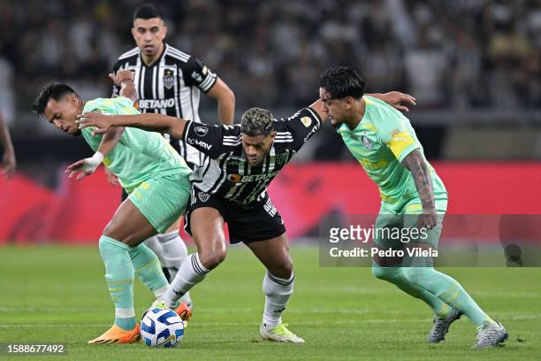 Hulk of Atletico Mineiro challenges for the ball with Gabriel Menino and Gustavo Gomez of Palmeiras during the Copa CONMEBOL Libertadores round of 16...