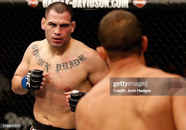 Cain Velasquez squares off with Junior dos Santos during their heavyweight championship fight at UFC 155 on December 29, 2012 at MGM Grand Garden...