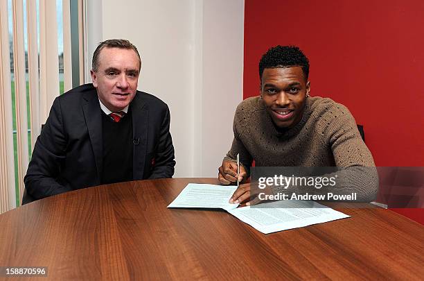 Daniel Sturridge completes his transfer to Liverpool FC with managing director Ian Ayre at Melwood Training Ground on January 2, 2013 in Liverpool,...