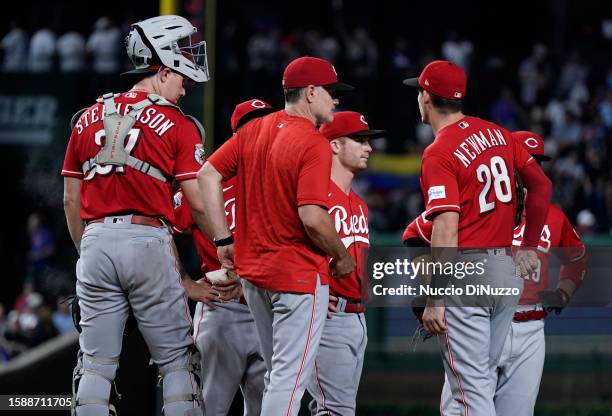 Manager David Bell of the Cincinnati Reds visits the mound to make a pitching change during the fifth inning against the Chicago Cubs at Wrigley...