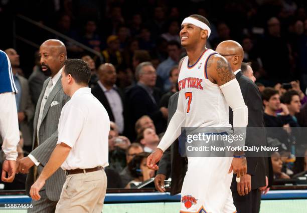 New York Knicks against the Los Angeles Lakers at Madison Square Garden. New York Knicks small forward Carmelo Anthony grimaces in pain as he walks...