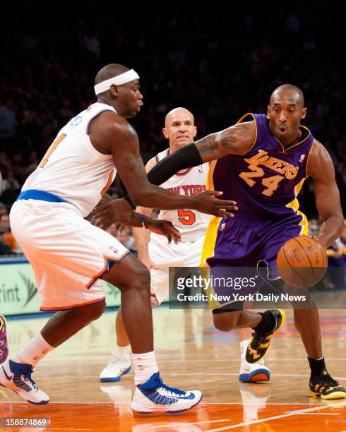New York Knicks against the Los Angeles Lakers at Madison Square Garden.Los Angeles Lakers shooting guard Kobe Bryant drives past New York Knicks...