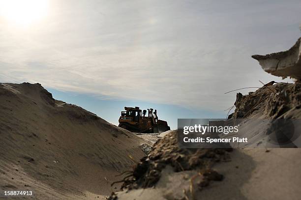 Construction of a new sea wall begins along the beach in the Belle Harbor neighborhood in the Rockaways on January 2, 2013 in the Queens borough of...