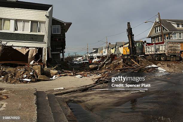 Destroyed home is viewed along the beach in the Belle Harbor neighborhood in the Rockaways on January 2, 2013 in the Queens borough of New York City....