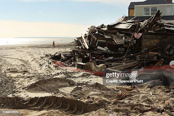 Destroyed home is viewed along the beach in the Belle Harbor neighborhood in the Rockaways on January 2, 2013 in the Queens borough of New York City....