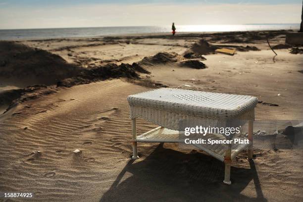 Piece of furniture from a destroyed home sits on the beach in the Belle Harbor neighborhood in the Rockaways on January 2, 2013 in the Queens borough...