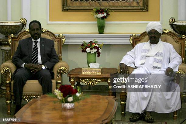 Somali President Hassan Sheik Mahmud meets with Sudanese President Omar al-Bashir at the presidential palace in Khartoum, on January 2, 2013. AFP...