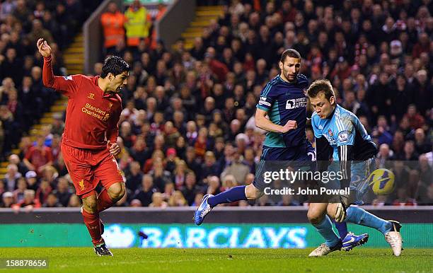 Luis Suarez of Liverpool scores the third goal during the Barclays Premier League match between Liverpool and Sunderland at Anfield on January 2,...