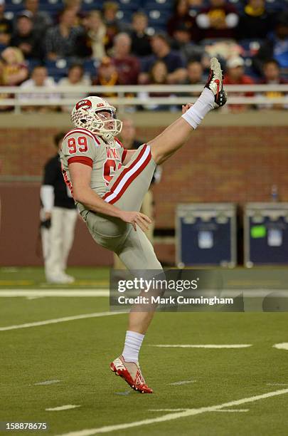 Hendrix Brakefield of the Western Kentucky University Hilltoppers punts the football during the Little Caesars Pizza Bowl against the Central...