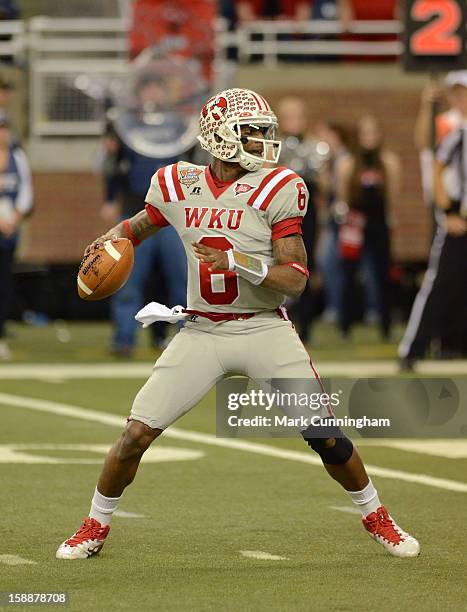 Kawaun Jakes of the Western Kentucky University Hilltoppers throws a pass during the Little Caesars Pizza Bowl against the Central Michigan...