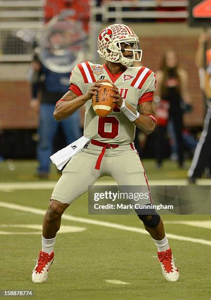 Kawaun Jakes of the Western Kentucky University Hilltoppers looks to throw a pass in the first quarter of the Little Caesars Pizza Bowl against the...