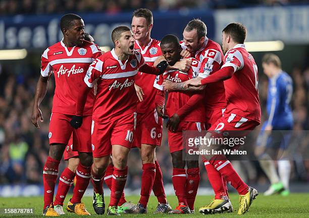 Shaun Wright Phillips of Queens Park Rangers with team mates after he scores the opening goal during the Barclays Premier League match between...