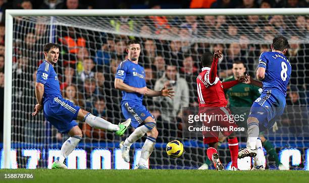 Shaun Wright Phillips of Queens Park Rangers scores the opening goal during the Barclays Premier League match between Chelsea and Queens Park Rangers...