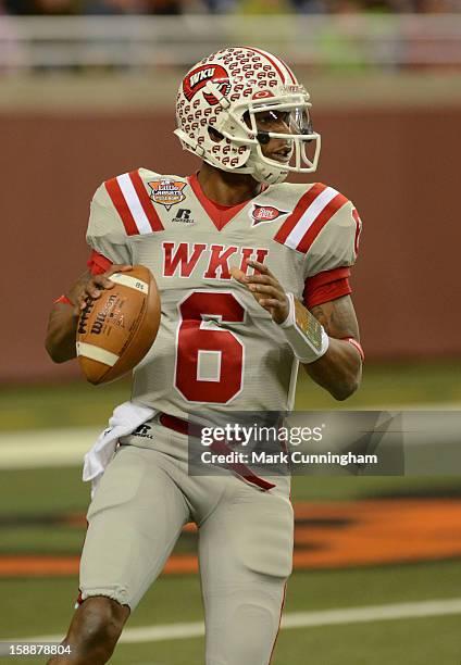 Kawaun Jakes of the Western Kentucky University Hilltoppers looks to throw a pass during the Little Caesars Pizza Bowl against the Central Michigan...