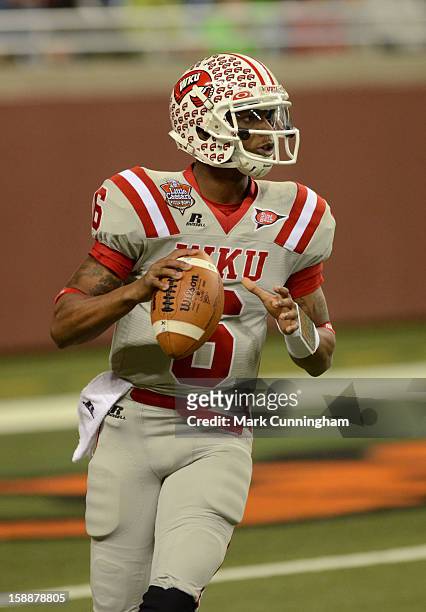 Kawaun Jakes of the Western Kentucky University Hilltoppers looks to throw a pass during the Little Caesars Pizza Bowl against the Central Michigan...