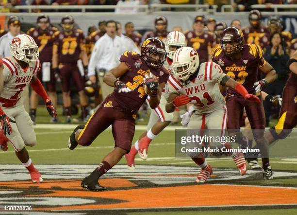 Zurlon Tipton of the Central Michigan University Chippewas runs with the football during the Little Caesars Pizza Bowl against the Western Kentucky...