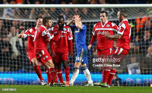 Shaun Wright Phillips of Queens Park Rangers with team mates after he scores the opening goal during the Barclays Premier League match between...