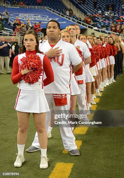 Western Kentucky University Hilltoppers cheerleaders stand during the National Anthem prior to the Little Caesars Pizza Bowl against the Central...