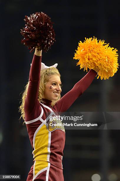 Central Michigan University Chippewas cheerleader looks on during the Little Caesars Pizza Bowl against the Western Kentucky University Hilltoppers...