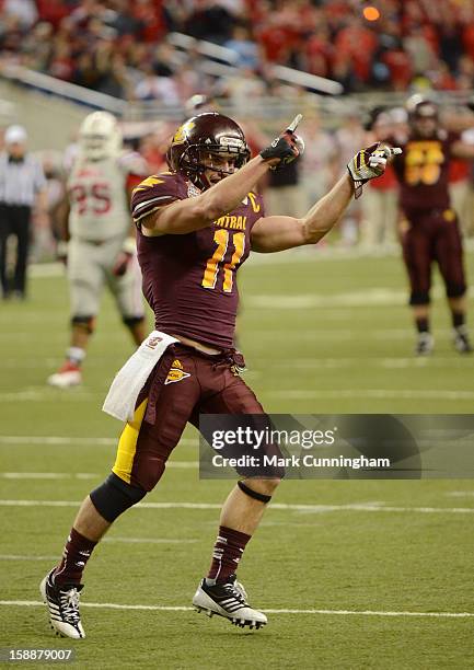 Cody Wilson of the Central Michigan University Chippewas celebrates a score during the Little Caesars Pizza Bowl against the Western Kentucky...