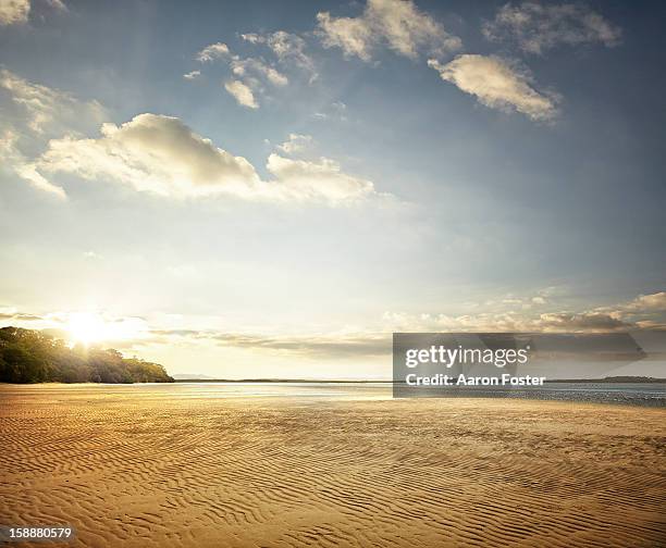 ocean inlet - beach sunset stockfoto's en -beelden