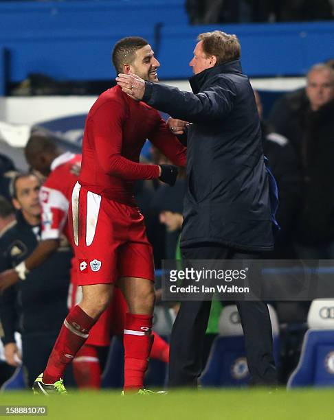 Adel Taarabt of Queens Park Rangers celebrates victory with manager Harry Redknapp after the Barclays Premier League match between Chelsea and Queens...