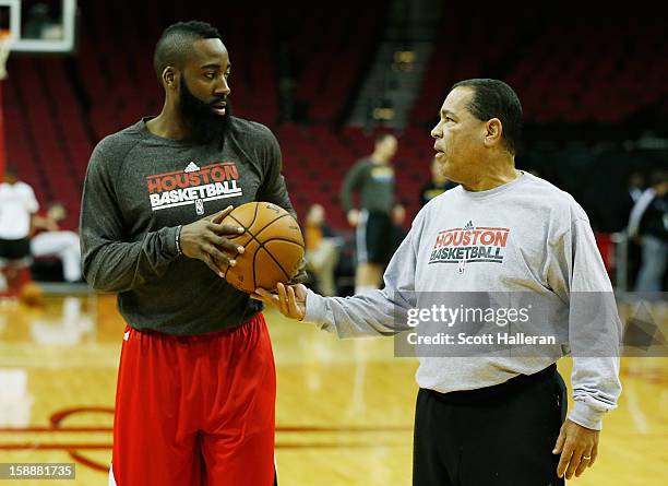 Rockets assistant coach Kelvin Sampson chats with James Harden prior to the start of the game between the New Orleans Hornets v Houston Rockets at...