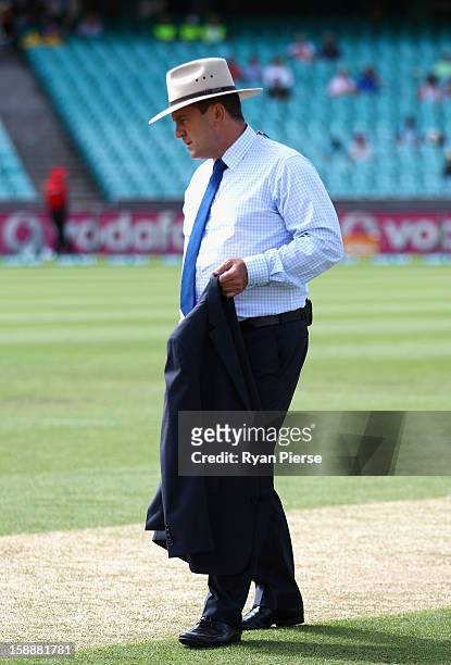 Mark Taylor, former Australian Captain and current Channel 9 commentator, wears a wide brim hat honour Tony Grieg who passed away last week during...