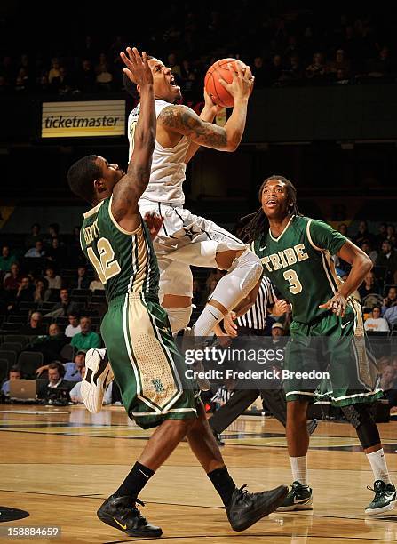 Kyle Fuller of the Vanderbilt Commodores takes a shot between Brandon Britt and Marcus Thornton of William & Mary at Memorial Gym on January 2, 2013...