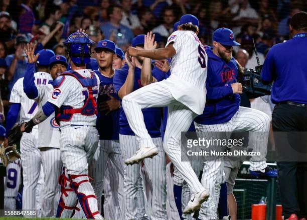 The Chicago Cubs celebrate their team win over the Cincinnati Reds at Wrigley Field on August 02, 2023 in Chicago, Illinois. The Cubs defeated the...