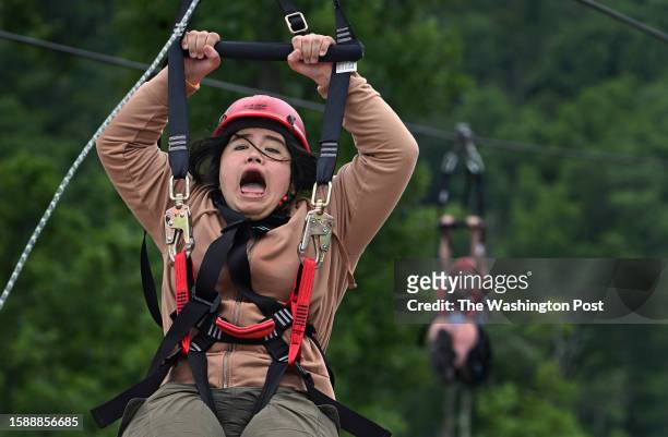 Mia Strouder was surprised at how quickly the zip line slowed at the end of the ride at the 2023 National Scout Jamboree in Glen Jean, West Virginia...