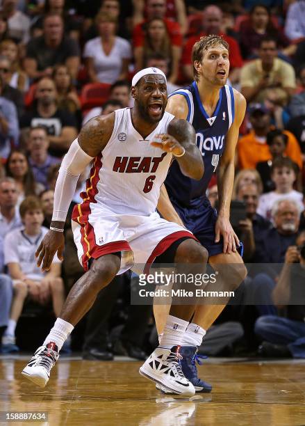 LeBron James of the Miami Heat guards Dirk Nowitzki of the Dallas Mavericks during a game at American Airlines Arena on January 2, 2013 in Miami,...