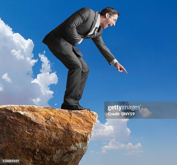 laughing businessman - man in suit pointing stock pictures, royalty-free photos & images