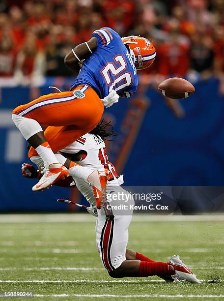 Terell Floyd of the Louisville Cardinals breaks up a pass intended for Omarius Hines of the Florida Gators during the Allstate Sugar Bowl at...